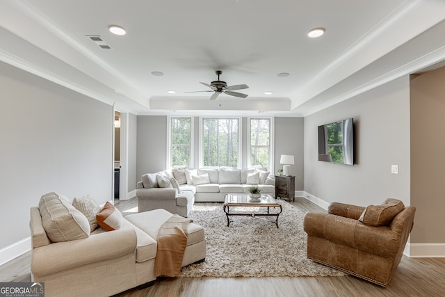 4781 Falling Brook Dr, Flowery Branch, GA 30542 - living area featuring a raised ceiling, ceiling fan, healthy amount of natural light, and recessed lighting