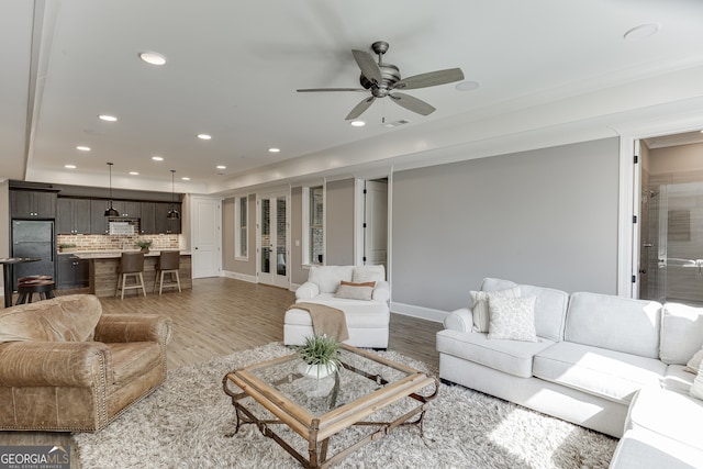4781 Falling Brook Dr, Flowery Branch, GA 30542 - living room with wood finished floors, a ceiling fan, recessed lighting, baseboards, and ornamental molding