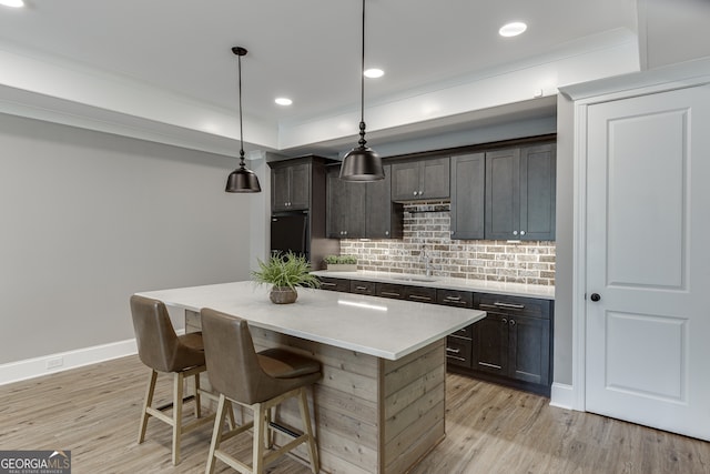 4781 Falling Brook Dr, Flowery Branch, GA 30542 - kitchen with a sink, light wood-style flooring, tasteful backsplash, light countertops, and recessed lighting