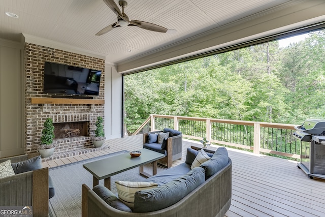 4781 Falling Brook Dr, Flowery Branch, GA 30542 - wooden terrace featuring an outdoor living space with a fireplace, a ceiling fan, and grilling area