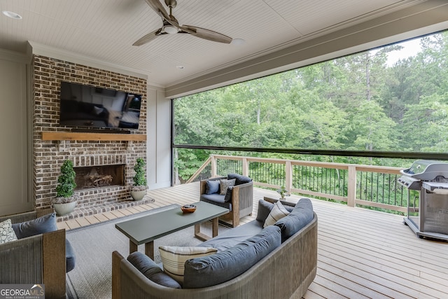 4781 Falling Brook Dr, Flowery Branch, GA 30542 - wooden deck featuring an outdoor living space with a fireplace, grilling area, a ceiling fan, and a wooded view