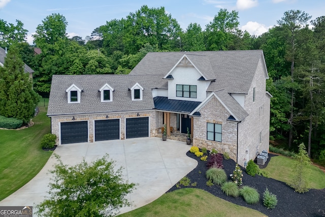 4781 Falling Brook Dr, Flowery Branch, GA 30542 - view of front of home with concrete driveway, a front lawn, a shingled roof, stone siding, and a garage