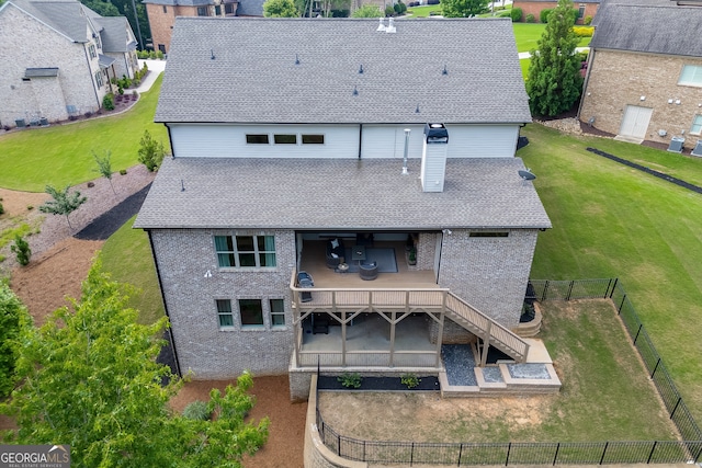 4781 Falling Brook Dr, Flowery Branch, GA 30542 - rear view of house with brick siding, a patio, roof with shingles, and a deck