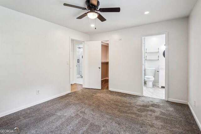 232 Apple Branch Dr, Woodstock, GA 30188 - unfurnished bedroom with carpet floors, a walk in closet, connected bathroom, and recessed lighting