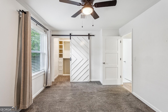 232 Apple Branch Dr, Woodstock, GA 30188 - unfurnished room with carpet flooring, a ceiling fan, baseboards, and a barn door