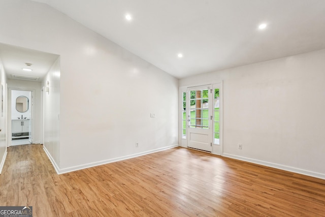 232 Apple Branch Dr, Woodstock, GA 30188 - spare room with light wood-style floors, baseboards, vaulted ceiling, and recessed lighting