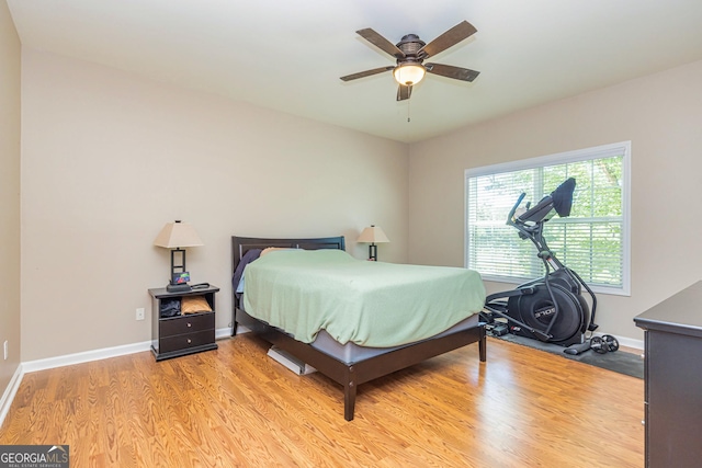 111 Portico Pl, Newnan, GA 30265 - bedroom featuring light wood-style flooring, baseboards, and a ceiling fan