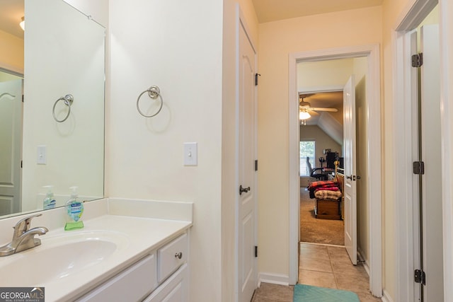 111 Portico Pl, Newnan, GA 30265 - bathroom featuring vaulted ceiling, ceiling fan, vanity, tile patterned flooring, and baseboards
