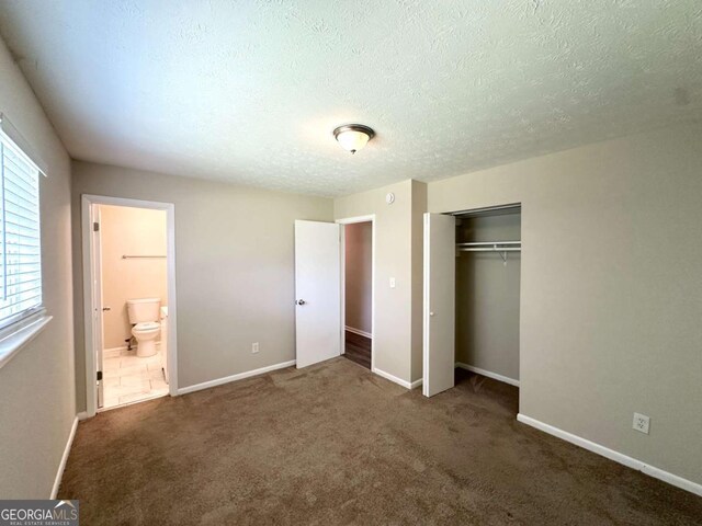 3730 Stephanie Dr SW, Atlanta, GA 30331 - unfurnished bedroom with a closet, a textured ceiling, carpet floors, baseboards, and ensuite bath