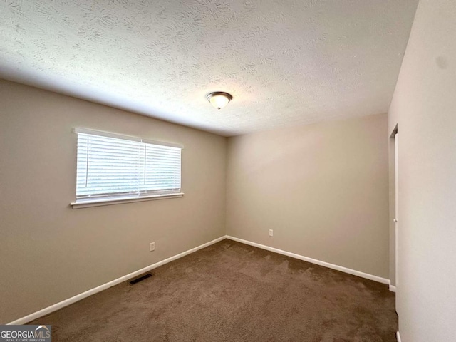 3730 Stephanie Dr SW, Atlanta, GA 30331 - unfurnished room featuring carpet, baseboards, and a textured ceiling