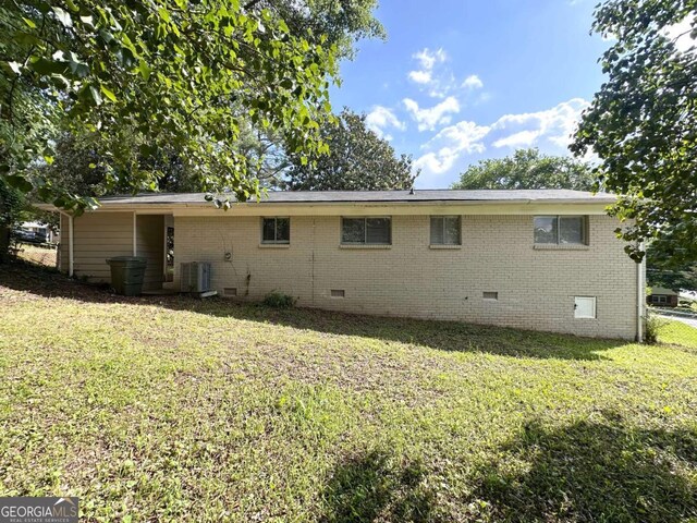 3730 Stephanie Dr SW, Atlanta, GA 30331 - rear view of house featuring crawl space, brick siding, and a yard