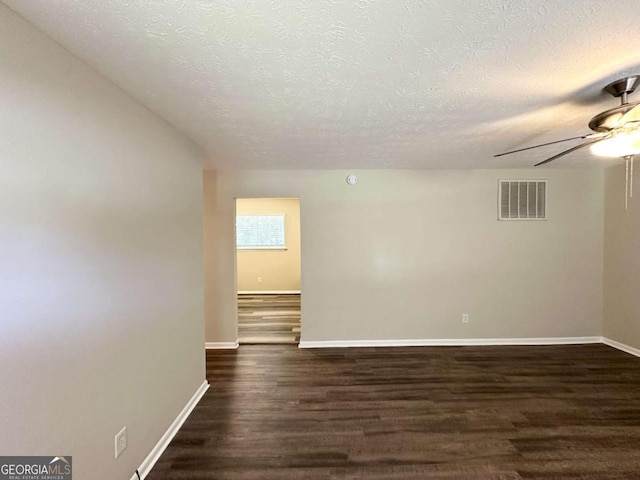 3730 Stephanie Dr SW, Atlanta, GA 30331 - unfurnished room with a textured ceiling, a ceiling fan, dark wood finished floors, and baseboards