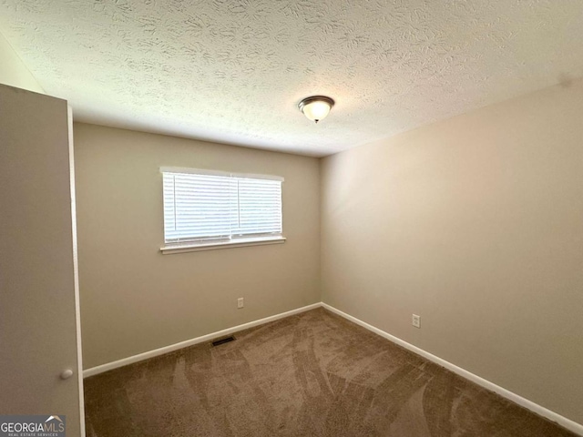 3730 Stephanie Dr SW, Atlanta, GA 30331 - empty room featuring carpet, baseboards, and a textured ceiling