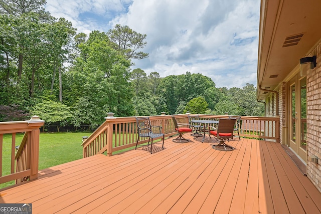 2149 New London Pl, Snellville, GA 30078 - wooden deck with outdoor dining space and a lawn