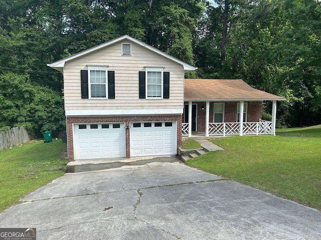 6536 Rebecca Lou Ln, Lithonia, GA 30058 - split level home featuring a porch, a front yard, asphalt driveway, and an attached garage