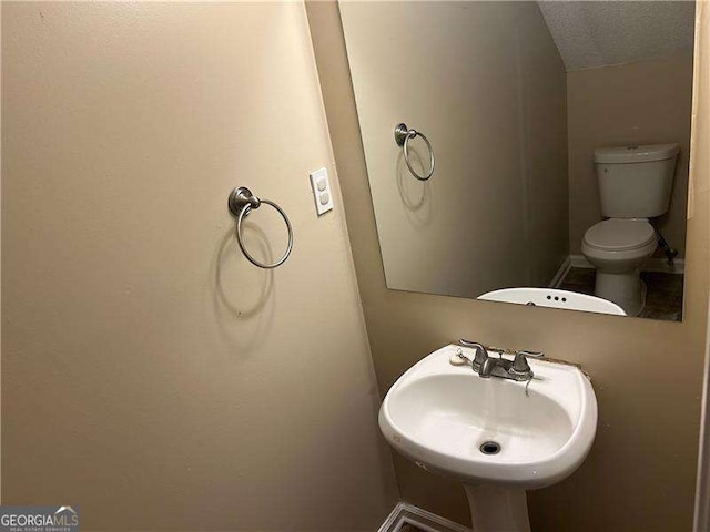 6536 Rebecca Lou Ln, Lithonia, GA 30058 - half bathroom featuring a sink and toilet