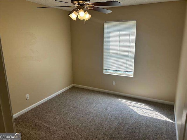 6536 Rebecca Lou Ln, Lithonia, GA 30058 - carpeted empty room with plenty of natural light and ceiling fan