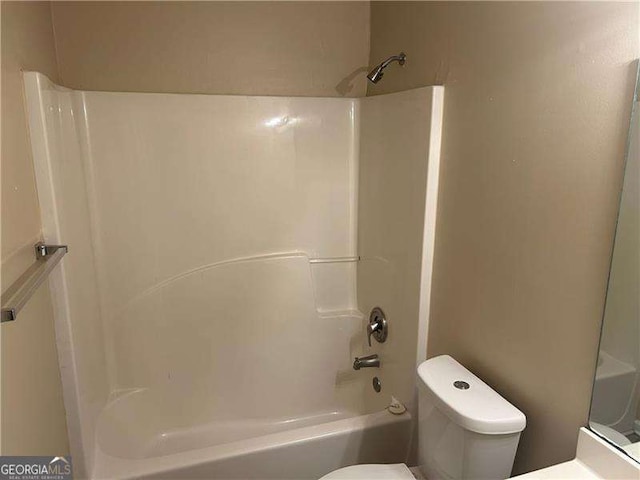 6536 Rebecca Lou Ln, Lithonia, GA 30058 - bathroom featuring toilet and shower / washtub combination