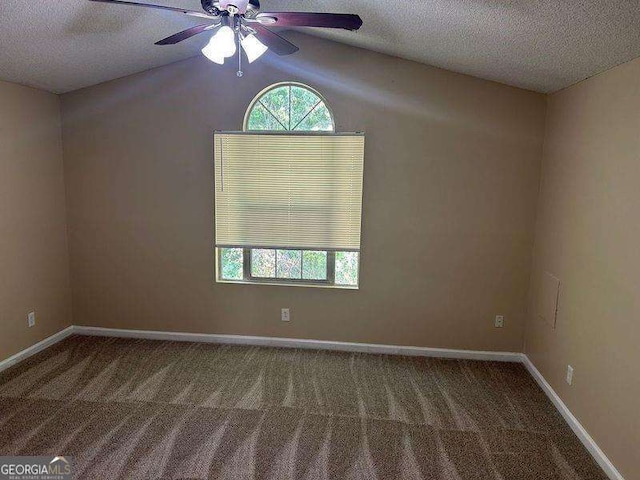 6536 Rebecca Lou Ln, Lithonia, GA 30058 - empty room with carpet flooring, a textured ceiling, a ceiling fan, and lofted ceiling