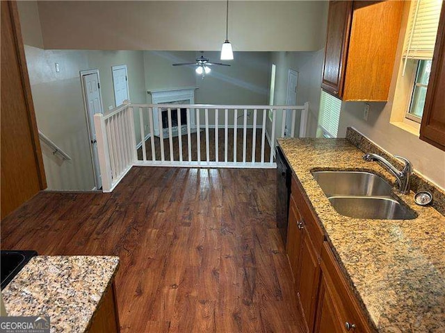 6536 Rebecca Lou Ln, Lithonia, GA 30058 - kitchen featuring brown cabinets, ceiling fan, light stone countertops, and dark wood-type flooring