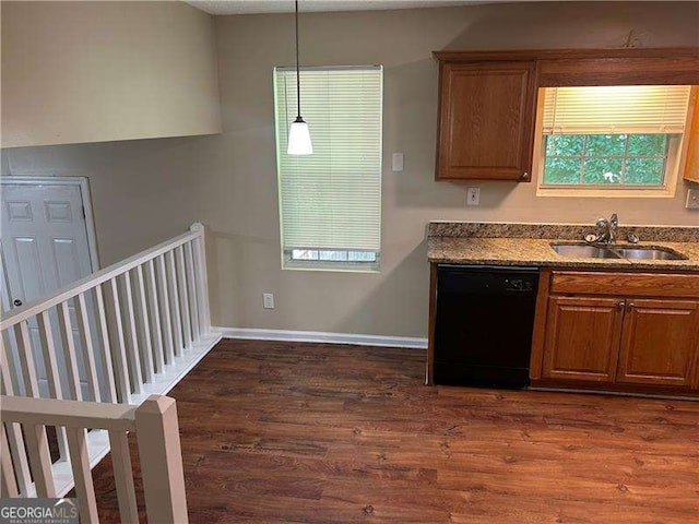 6536 Rebecca Lou Ln, Lithonia, GA 30058 - kitchen featuring dishwasher, dark wood-type flooring, brown cabinets, and pendant lighting