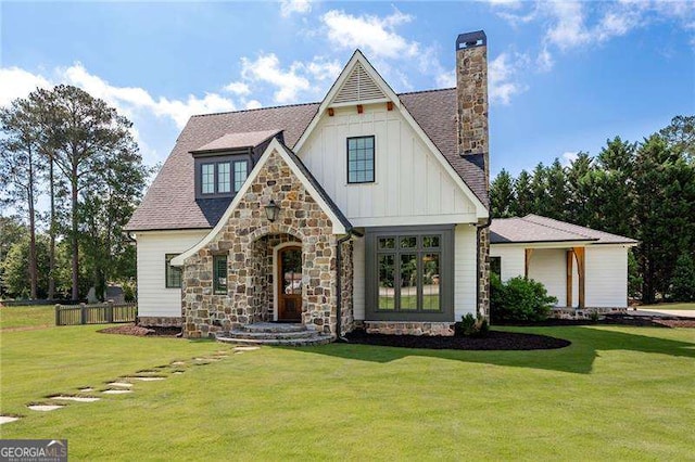 1830 Maple St, Carrollton, GA 30117 - view of front of property featuring board and batten siding, stone siding, and a chimney