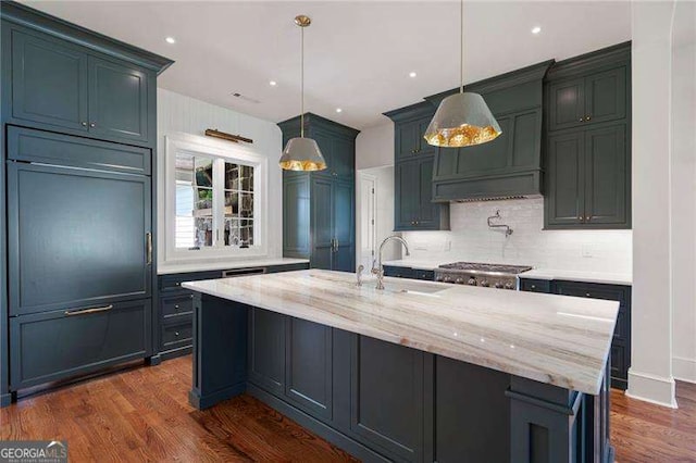 1830 Maple St, Carrollton, GA 30117 - kitchen with backsplash, a sink, dark wood finished floors, light stone countertops, and decorative light fixtures