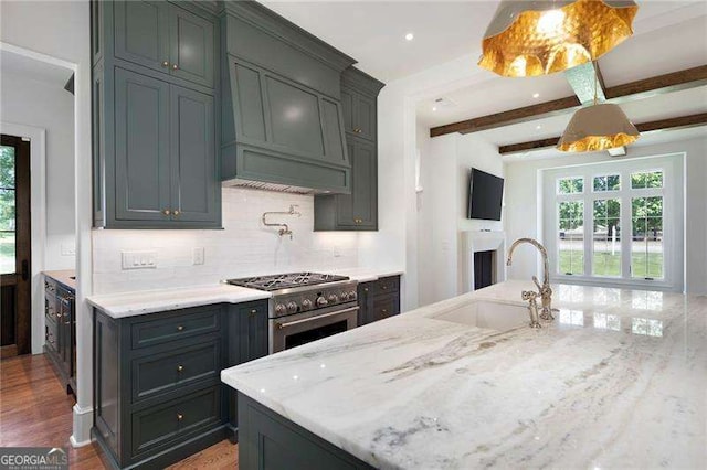 1830 Maple St, Carrollton, GA 30117 - kitchen with a sink, high end stainless steel range, healthy amount of natural light, light stone countertops, and beam ceiling