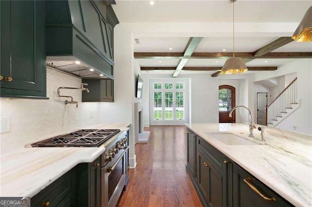 1830 Maple St, Carrollton, GA 30117 - kitchen featuring a sink, high end range, decorative backsplash, dark wood-style flooring, and beam ceiling