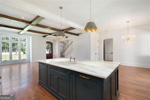 1830 Maple St, Carrollton, GA 30117 - kitchen featuring open floor plan, a sink, arched walkways, beam ceiling, and coffered ceiling