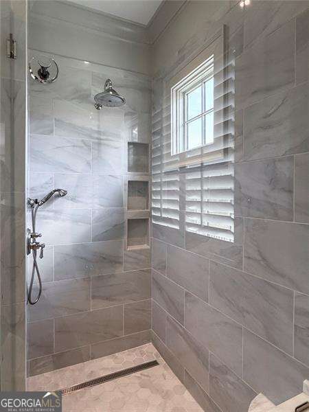 1830 Maple St, Carrollton, GA 30117 - bathroom featuring tiled shower