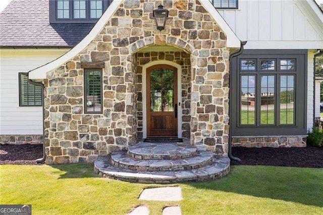 1830 Maple St, Carrollton, GA 30117 - view of exterior entry with stone siding, board and batten siding, and roof with shingles