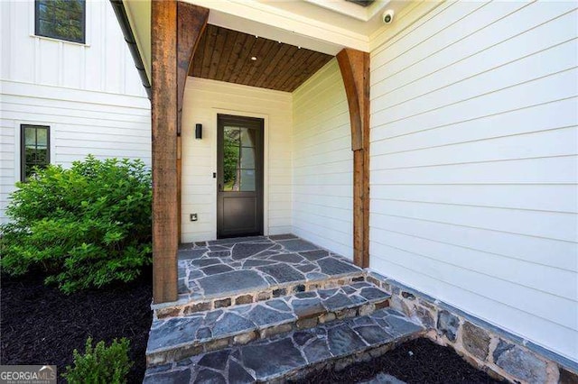 1830 Maple St, Carrollton, GA 30117 - entrance to property with a security system, a porch, and board and batten siding
