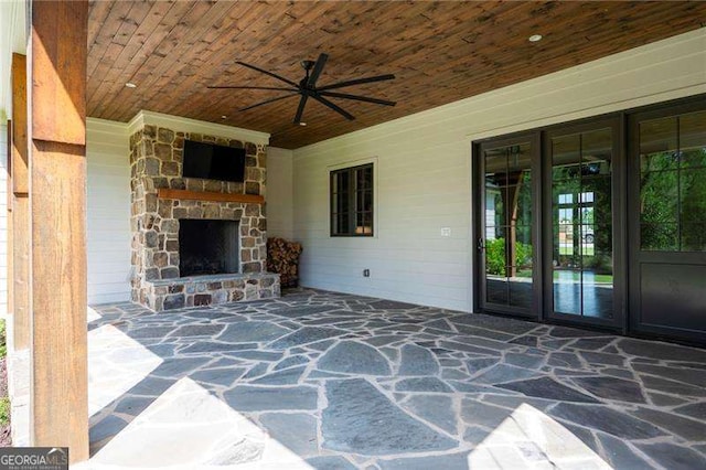 1830 Maple St, Carrollton, GA 30117 - view of patio / terrace featuring an outdoor stone fireplace and ceiling fan