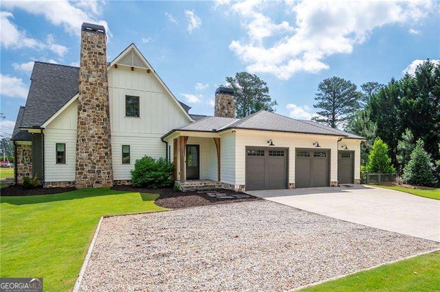 1830 Maple St, Carrollton, GA 30117 - modern farmhouse featuring a chimney, a garage, driveway, a front yard, and board and batten siding