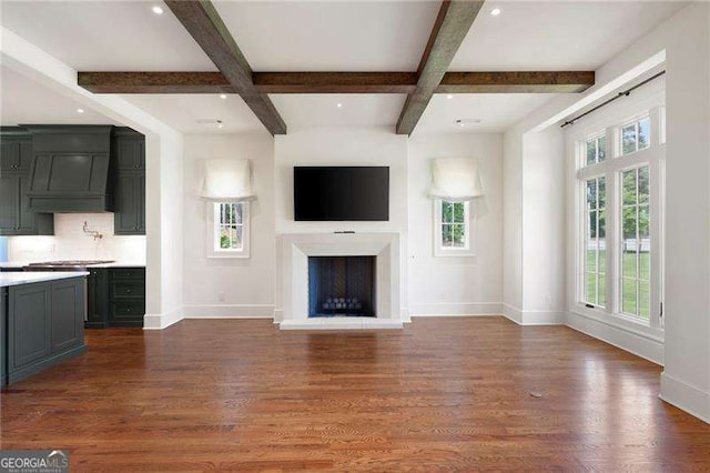 1830 Maple St, Carrollton, GA 30117 - unfurnished living room with baseboards, beamed ceiling, coffered ceiling, wood finished floors, and a fireplace with raised hearth