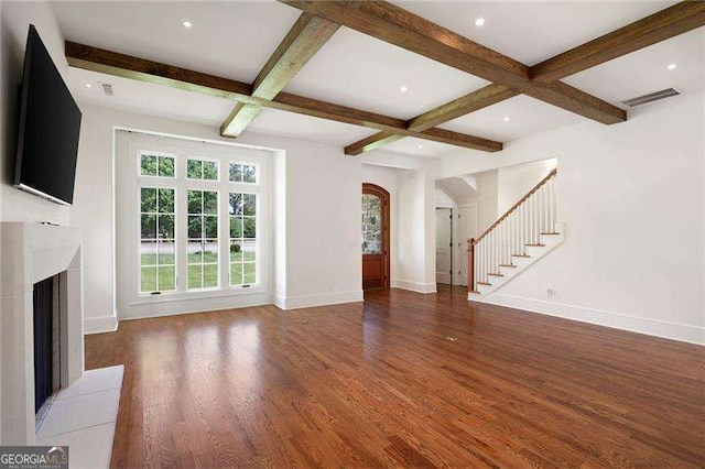 1830 Maple St, Carrollton, GA 30117 - unfurnished living room with coffered ceiling, arched walkways, baseboards, wood finished floors, and a fireplace