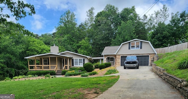 345 Davis Rd W, Fairmount, GA 30139 - view of front of home featuring covered porch, an outbuilding, stone siding, concrete driveway, and a chimney