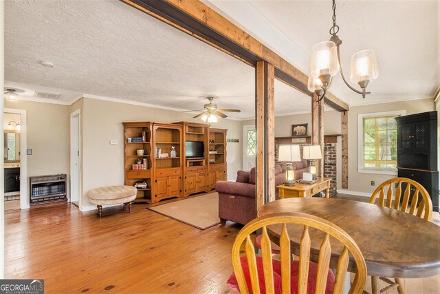 345 Davis Rd W, Fairmount, GA 30139 - dining area with heating unit, crown molding, light wood finished floors, a ceiling fan, and baseboards