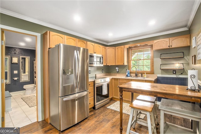 345 Davis Rd W, Fairmount, GA 30139 - kitchen with appliances with stainless steel finishes, a sink, light brown cabinetry, light countertops, and ornamental molding