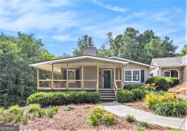 345 Davis Rd W, Fairmount, GA 30139 - view of front of home with covered porch and a chimney