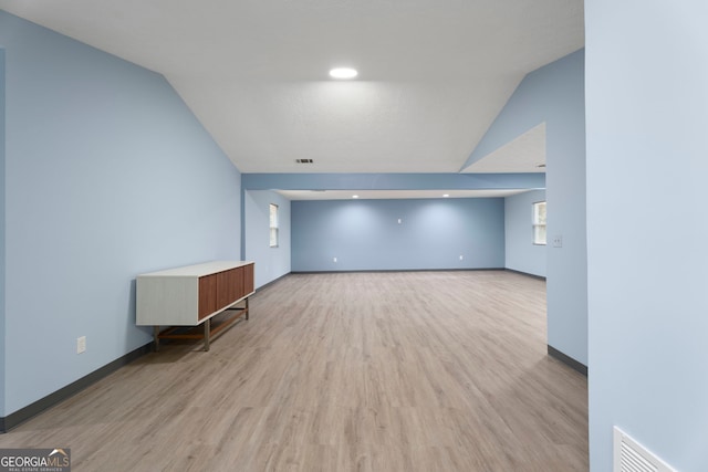 226 Old Atlanta Rd, Stockbridge, GA 30281 - spare room featuring light wood-type flooring, vaulted ceiling, and baseboards