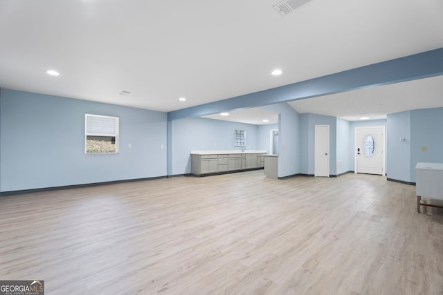 226 Old Atlanta Rd, Stockbridge, GA 30281 - unfurnished living room featuring light wood-type flooring, recessed lighting, and baseboards
