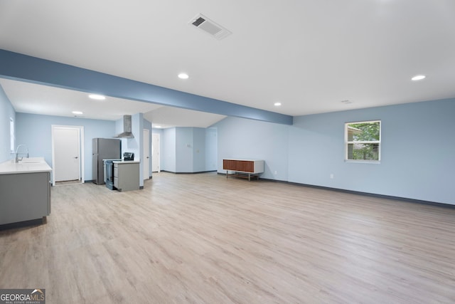 226 Old Atlanta Rd, Stockbridge, GA 30281 - unfurnished living room featuring light wood finished floors and recessed lighting