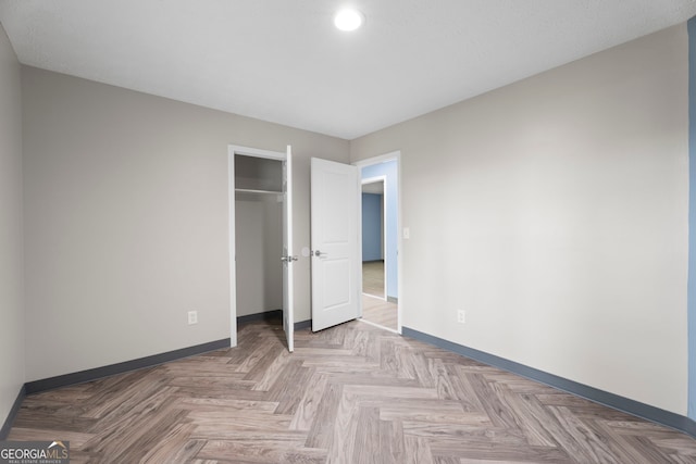 226 Old Atlanta Rd, Stockbridge, GA 30281 - unfurnished bedroom with baseboards, a closet, and recessed lighting