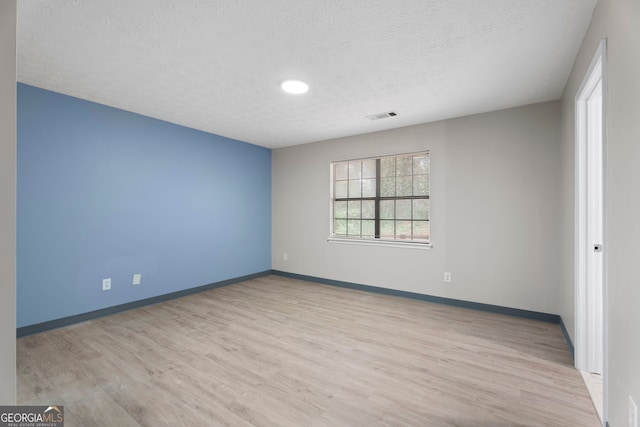 226 Old Atlanta Rd, Stockbridge, GA 30281 - unfurnished room with a textured ceiling, wood finished floors, baseboards, and recessed lighting