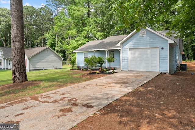 226 Old Atlanta Rd, Stockbridge, GA 30281 - view of front of home featuring an attached garage, concrete driveway, a front yard, and a shingled roof
