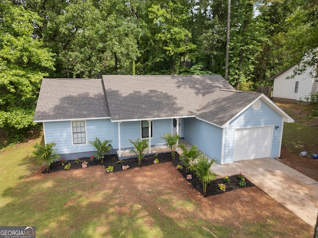 226 Old Atlanta Rd, Stockbridge, GA 30281 - ranch-style home with roof with shingles, an attached garage, concrete driveway, a porch, and a front lawn