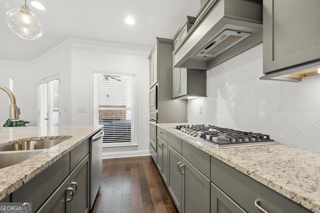 4044 Andover Cir, Mcdonough, GA 30252 - kitchen featuring gray cabinetry, appliances with stainless steel finishes, custom exhaust hood, a sink, and crown molding