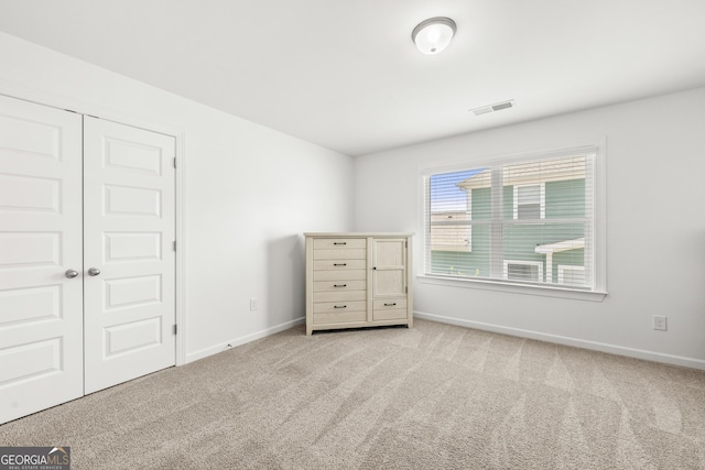4044 Andover Cir, Mcdonough, GA 30252 - unfurnished bedroom featuring carpet, baseboards, and a closet